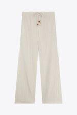 Pantalon beige pour femme, coupe élégante et style moderne, porté avec un haut assorti.