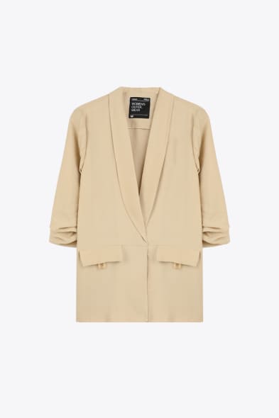 Veste beige femme chic, style naturel et polyvalent pour un look quotidien effortless